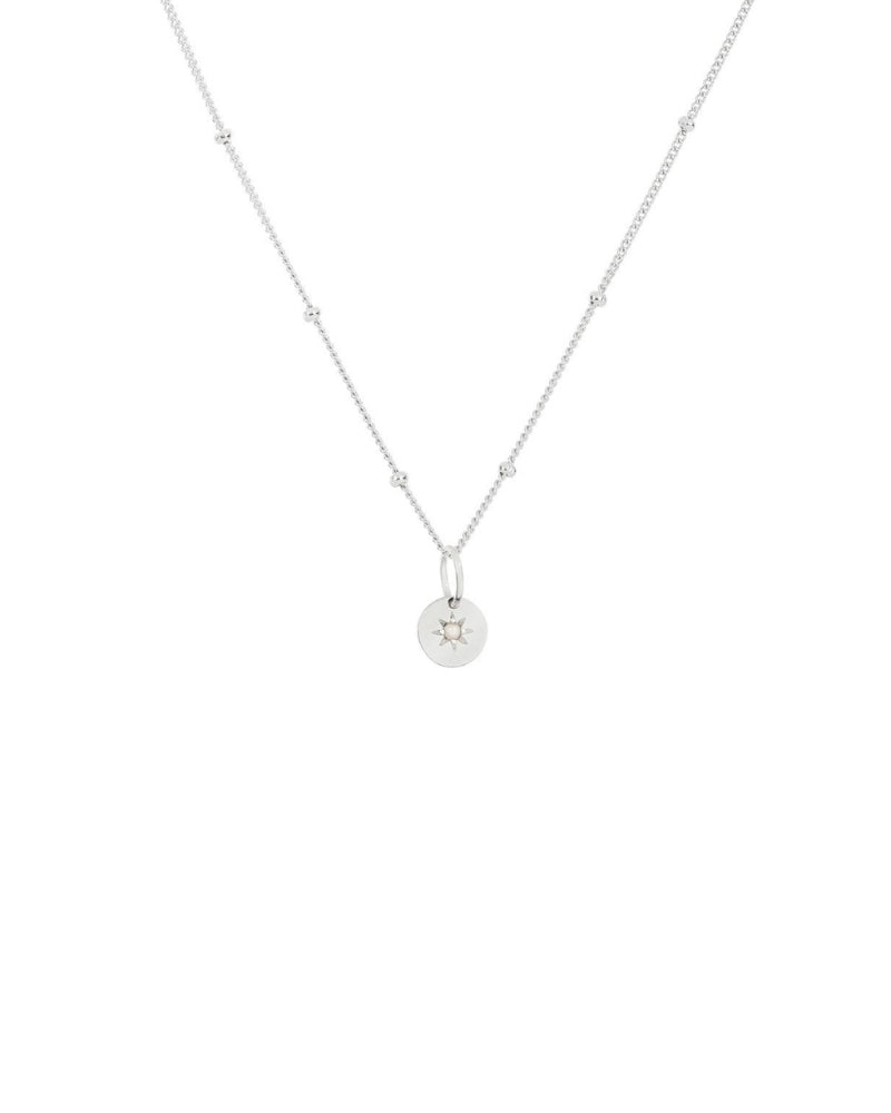 A vintage pearl necklace with a vintage inspired pendant with seed pearl in its centre.