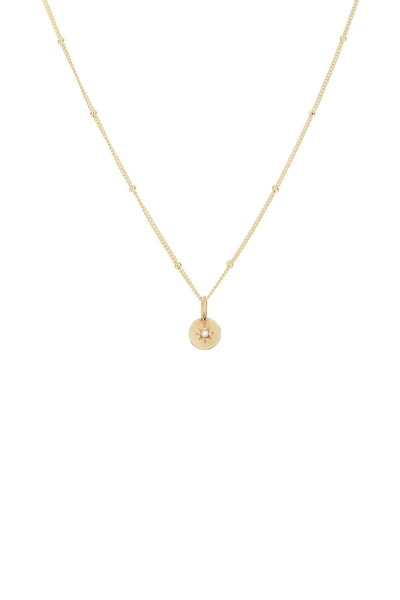 A vintage pearl necklace in gold. With a vintage inspired pendant with a seed pearl set within a star on a round pendant. The pendant hangs from a fine ball chain necklace.
