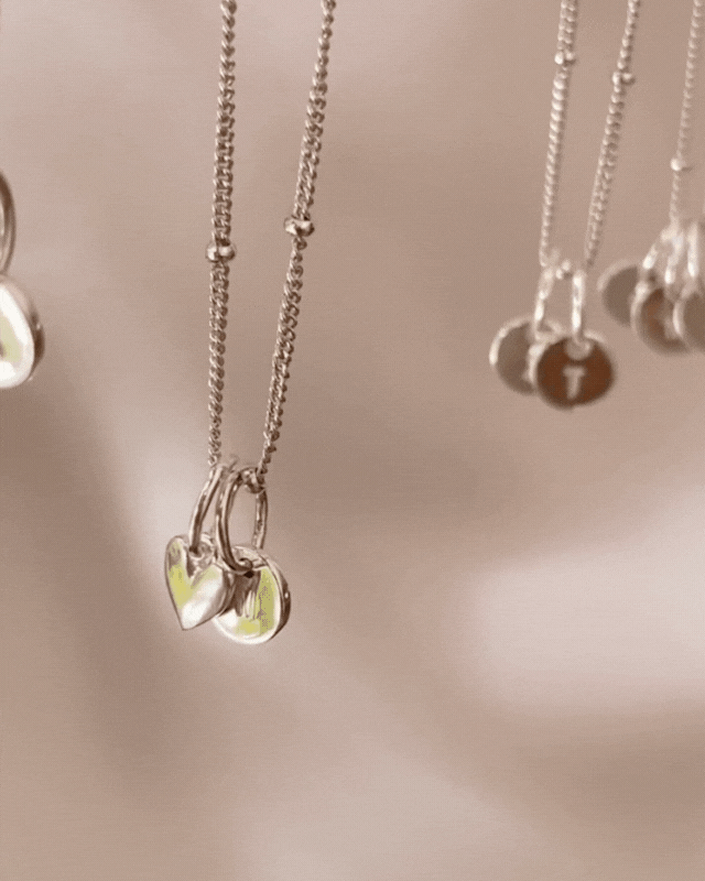 Bluebird co's Ball Chain necklace with mini sweetheart and initial pendants in silver.