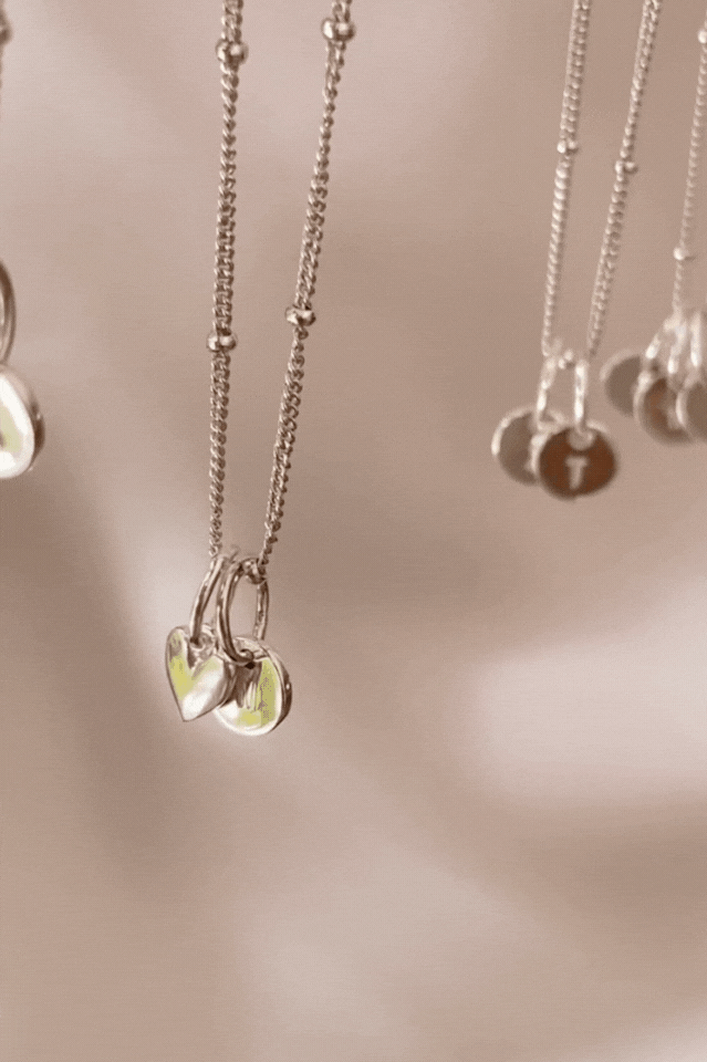 Bluebird co's Ball Chain necklace with mini sweetheart and initial pendants in silver.