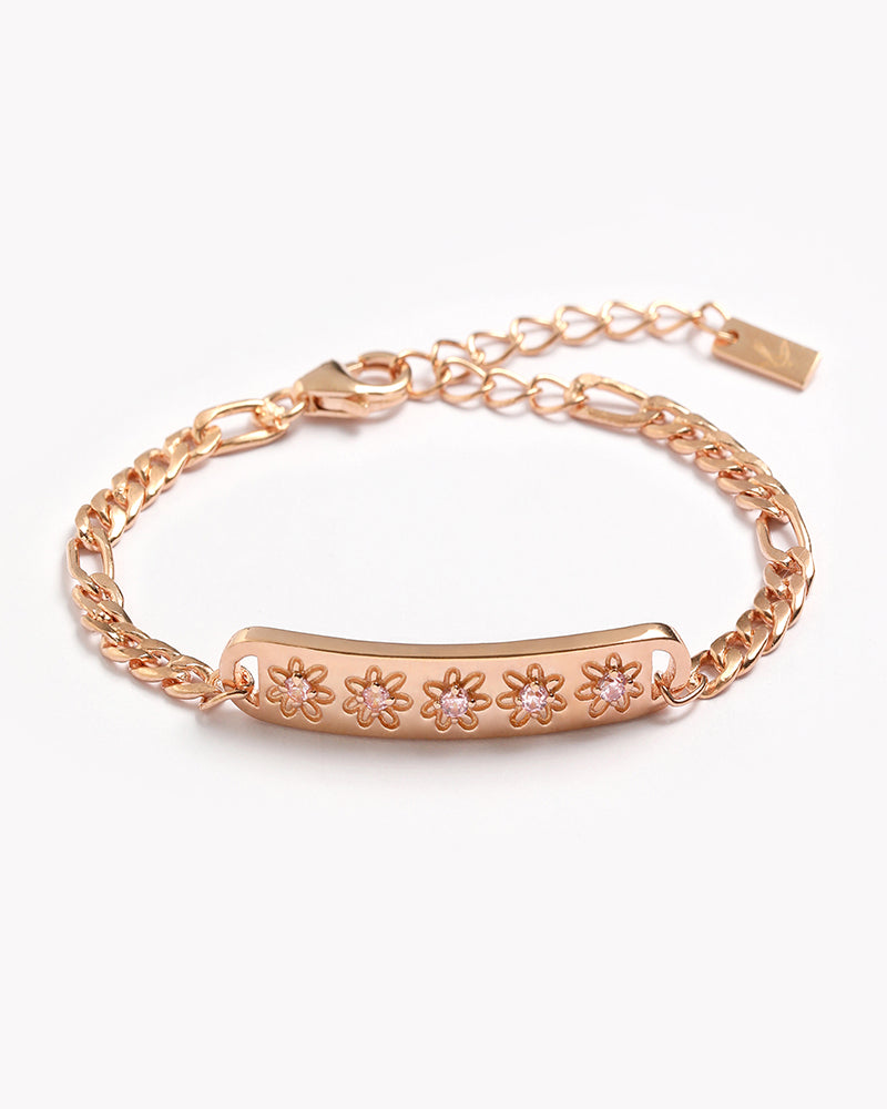 The Daisy Bracelet in Rosegold by Bluebird Jewellery, featuring five hand-drawn daisies with pink cubic zirconia centres, crafted as a feminine and floral fine jewellery piece.