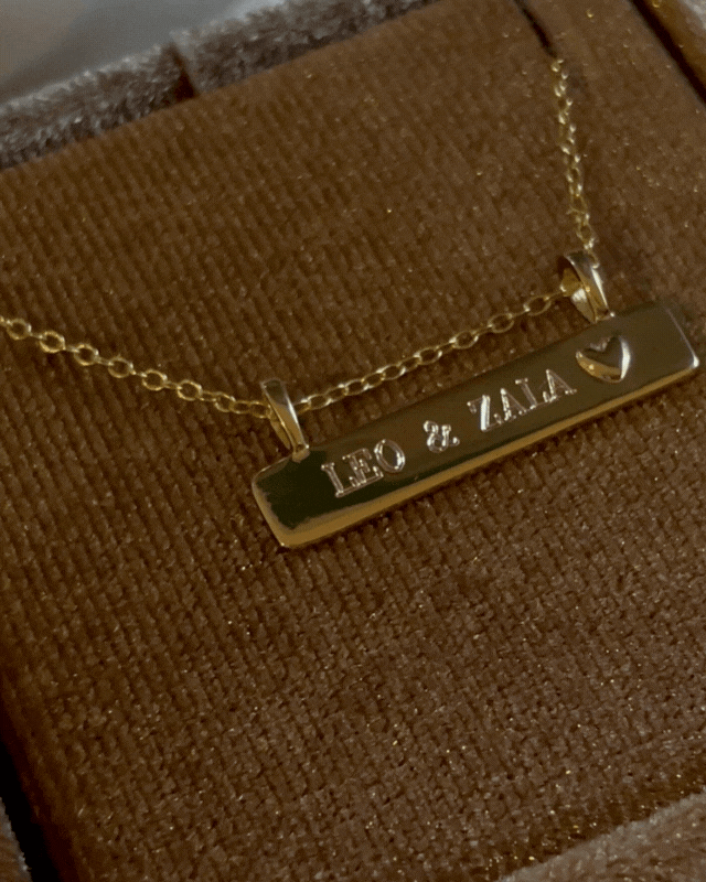 Bluebird Co's Darling Bar Necklace with 2 names engraved in velvet box.