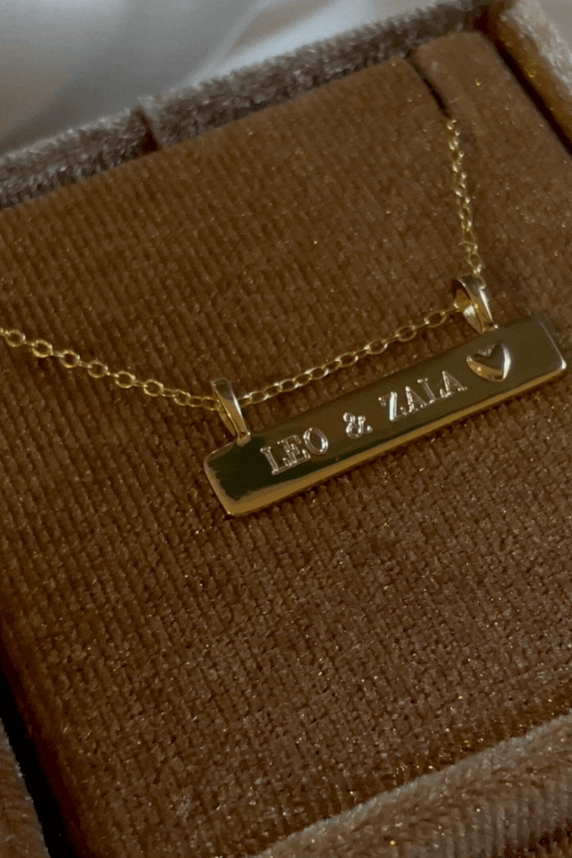 Bluebird Co's Darling Bar Necklace with 2 names engraved in velvet box.