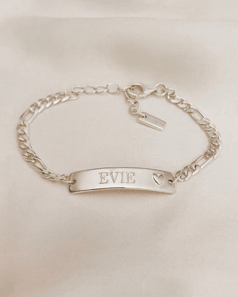 Personalised engraving on a Darling Bracelet . The engraving is on the front of the bar pendant of the ID bracelet and features the name 'Evie' by Bluebird Jewellery.