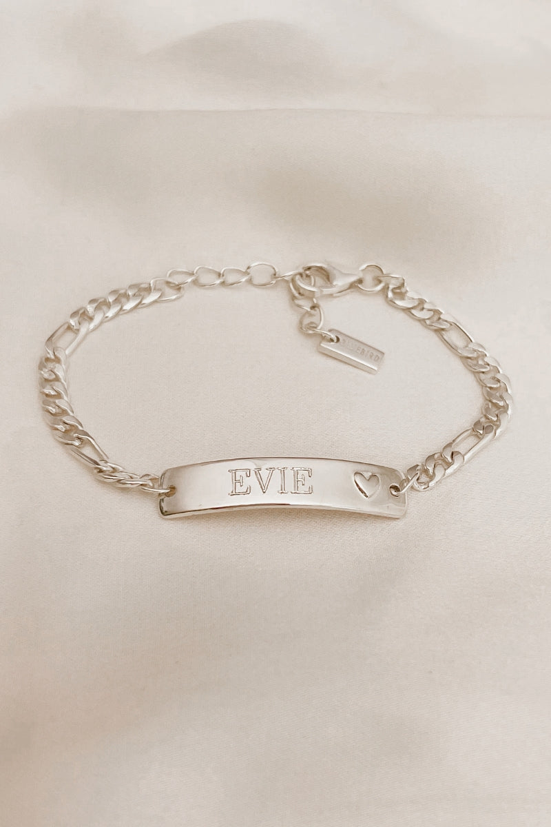 Personalised engraving on a Darling Bracelet . The engraving is on the front of the bar pendant of the ID bracelet and features the name 'Evie' by Bluebird Jewellery.