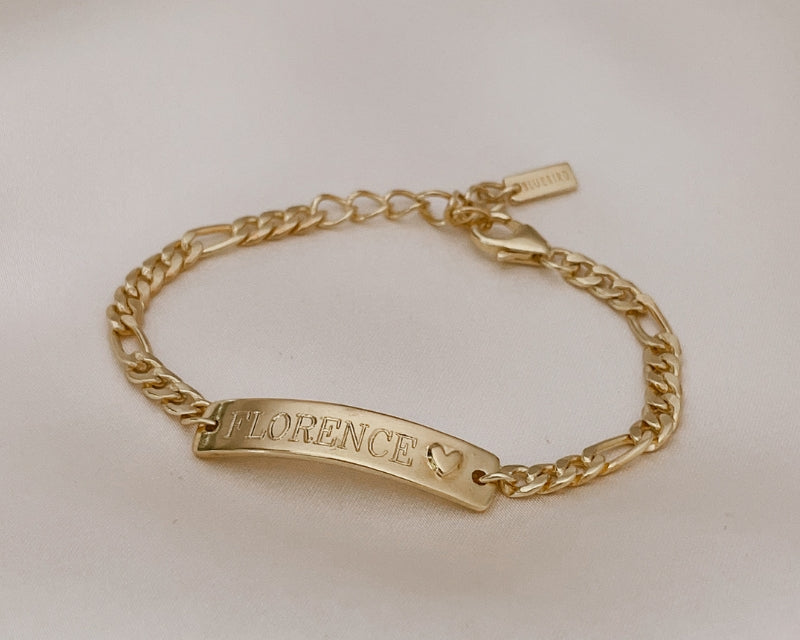 A Darling Bracelet with the name 'FLORENCE' engraved on the front of the personalised ID bracelet.