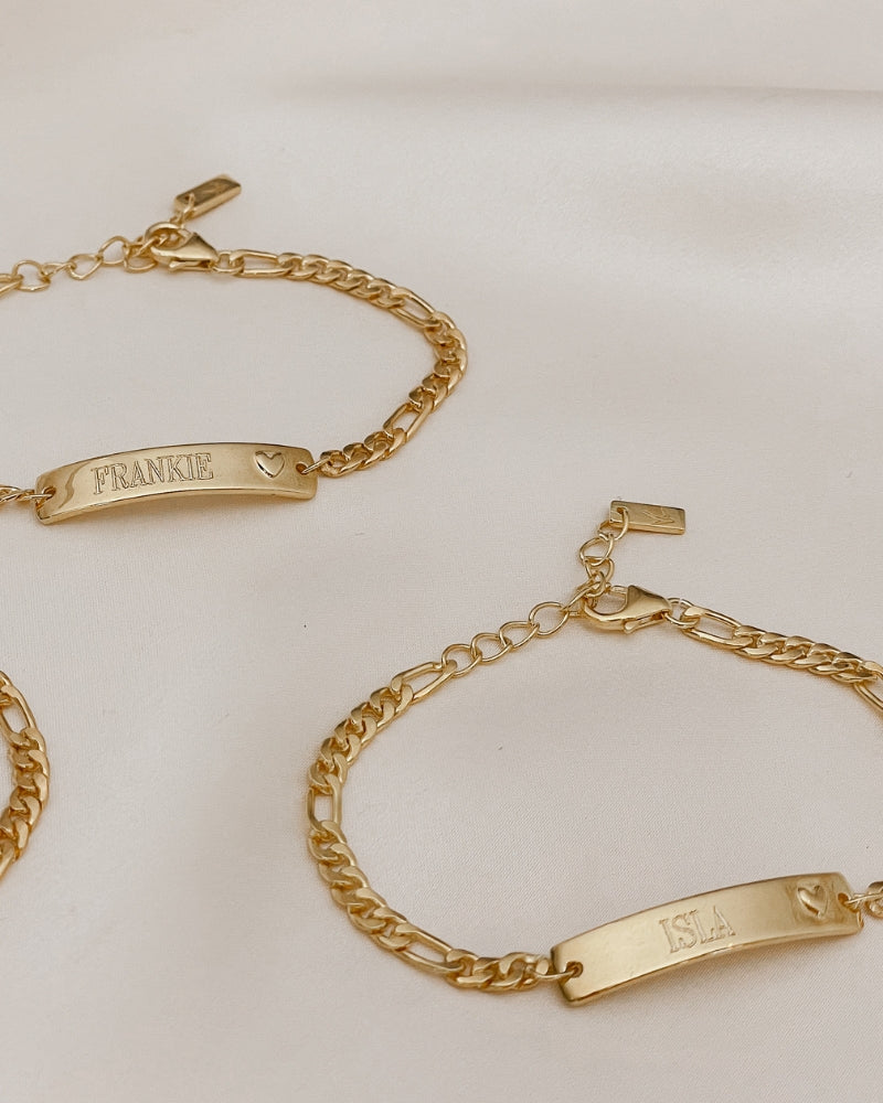 Engraved gold bracelets with heart detail, designed as personalised jewellery for babies, children, or adults by Bluebird Jewellery.