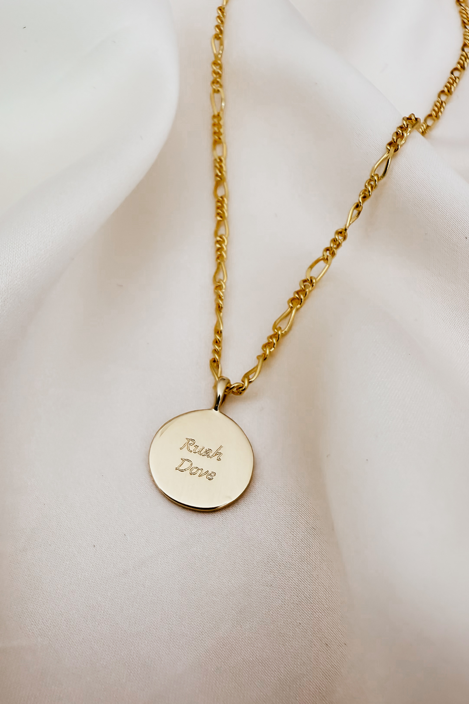 A close-up image of the Soléil Pendant – 9ct Gold with chain, featuring a radiant round design and complimentary engraving for a truly personal touch.