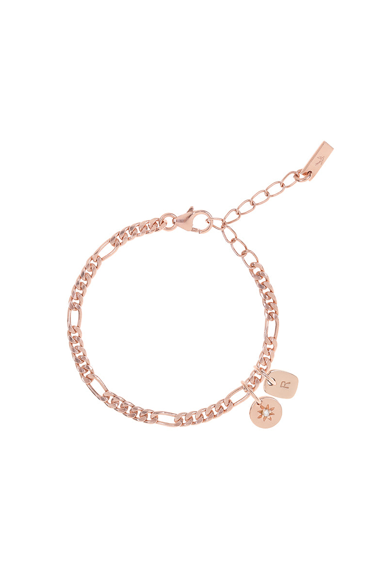 A detailed image of the Figaro Bracelet by Bluebird Jewellery, a classic rose gold chain bracelet with a 3cm extension for a perfect, adjustable fit along with an initial pendant and daisy pendant.