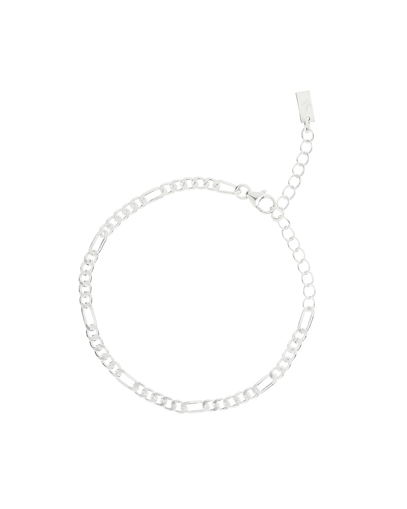 The Bluebird Jewellery Figaro Bracelet, a timeless fine chain design with adjustable sizing, crafted as an elegant everyday piece.
