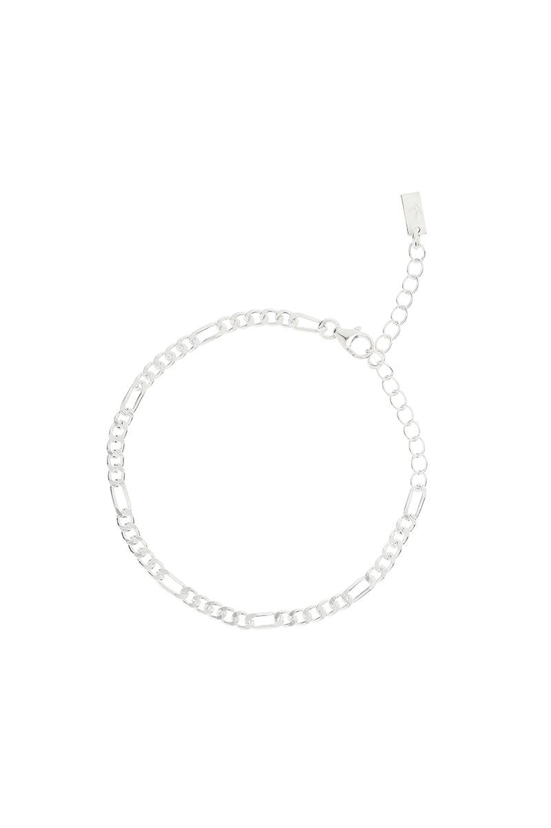 The Bluebird Jewellery Figaro Bracelet, a timeless fine chain design with adjustable sizing, crafted as an elegant everyday piece.