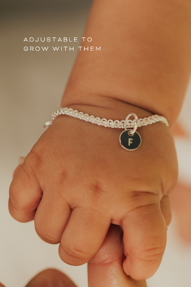 A delicate Lace Chain Bracelet with a heart charm and engraved initial pendant, designed as timeless personalised jewellery.