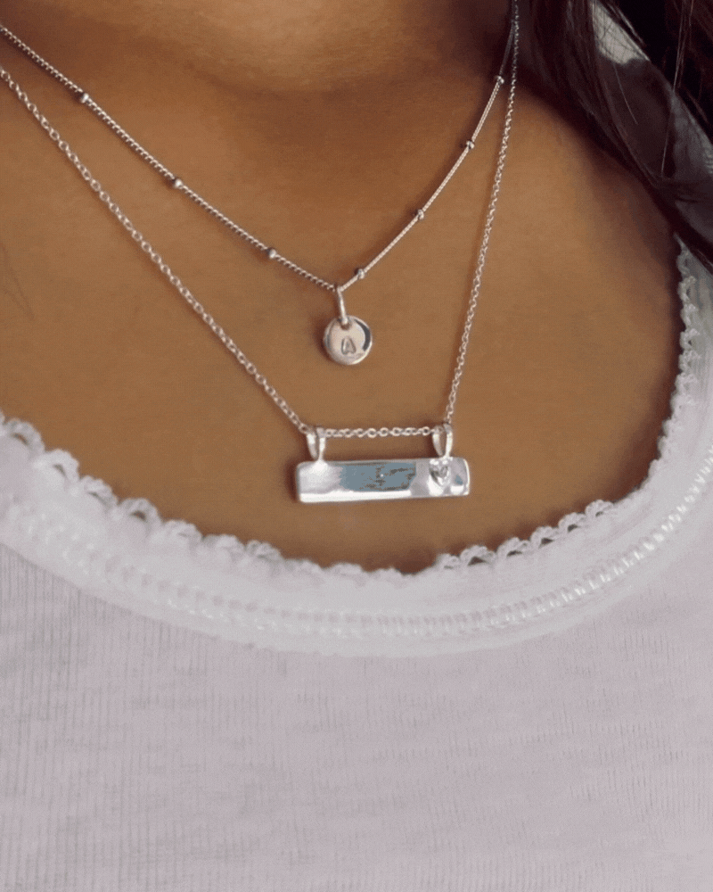 Bluebird Co's Ball chain necklace layered with darling necklace.