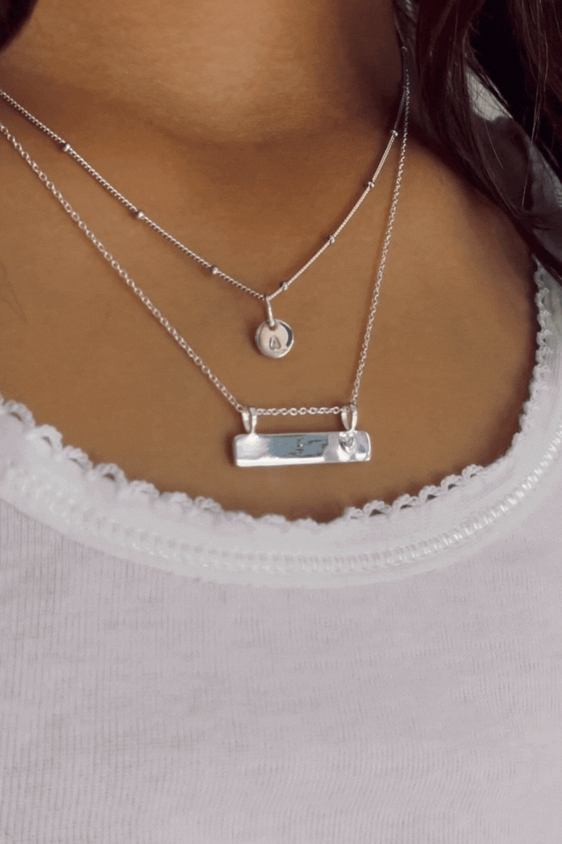 Bluebird Co's Ball chain necklace layered with darling necklace.