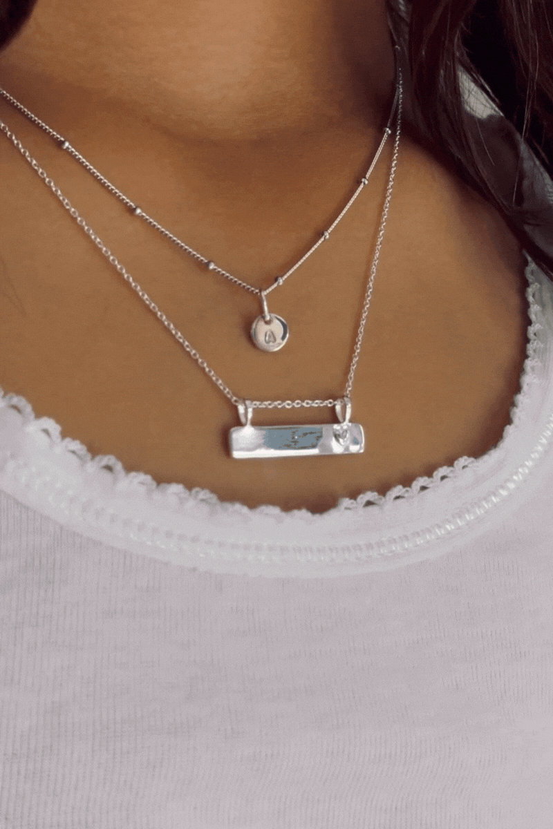 Bluebird Co's Ball chain necklace layered with darling necklace.