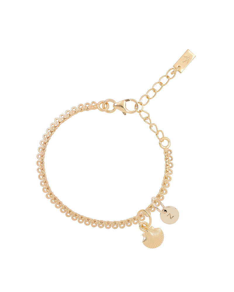 A detailed image of a gold Lace Chain bracelet with a mermaid shell charm and personalised soild gold initial pendant, designed as an elegant and whimsical piece of jewellery by Bluebird Co