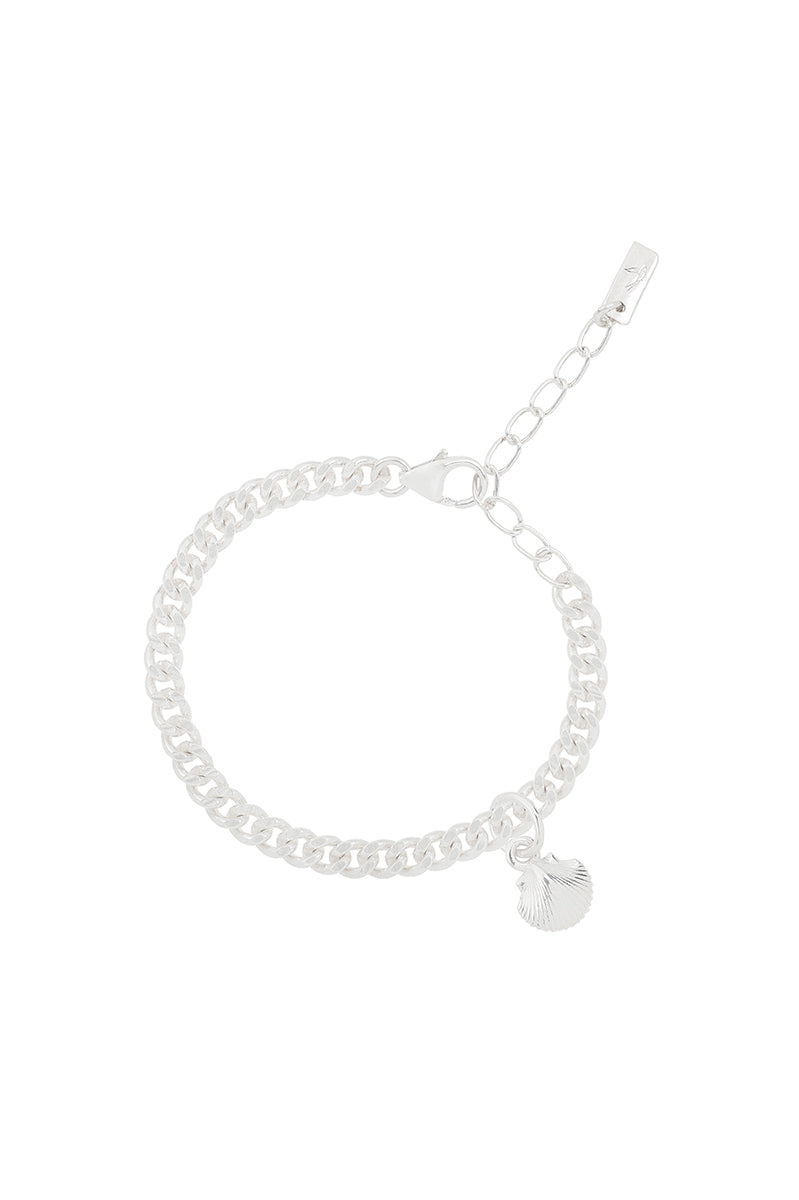 A delicate silver Cuban Link Chain Bracelet with a mermaid shell charm, designed as a timeless keepsake piece