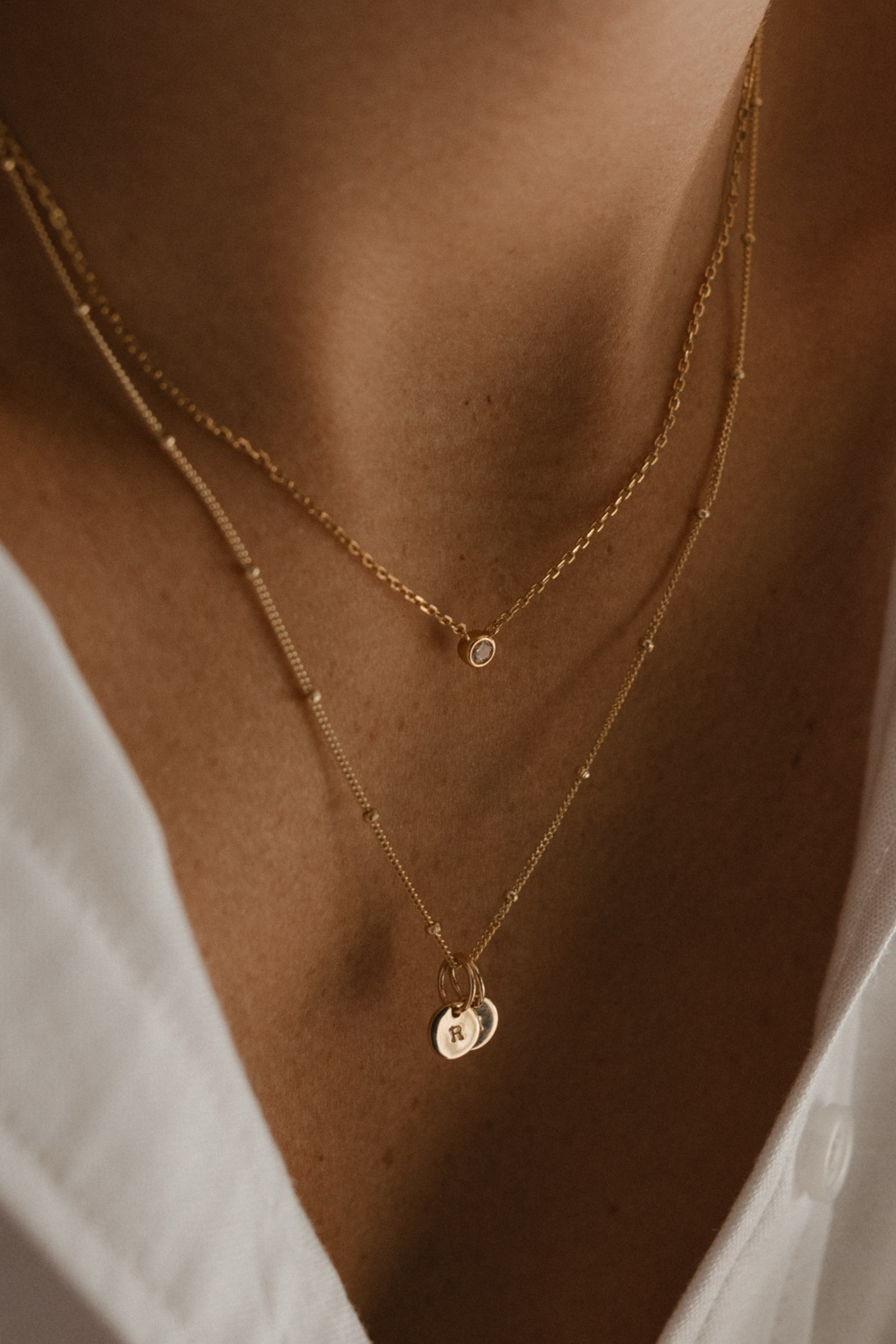 The Lumé Necklace by Bluebird Jewellery, a thoughtful gold pendant inspired by light and crafted as an elegant fine jewellery piece.