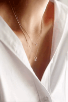 Bluebird Co Lume Necklace Gold layered with the ball chain necklace.