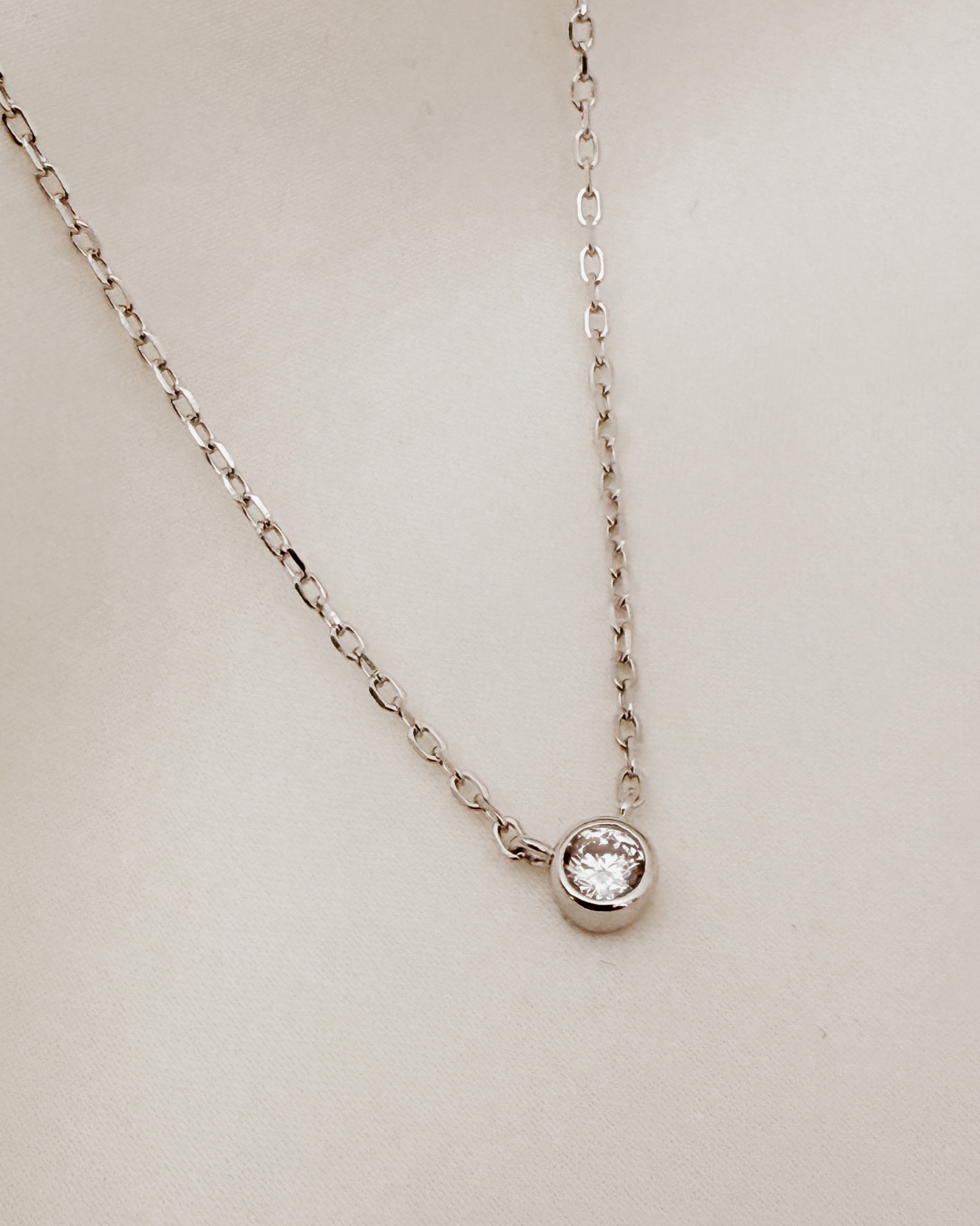 A delicate silver Lumé Necklace by Bluebird Jewellery, designed as a radiant keepsake symbolising light, love, and personal strength.