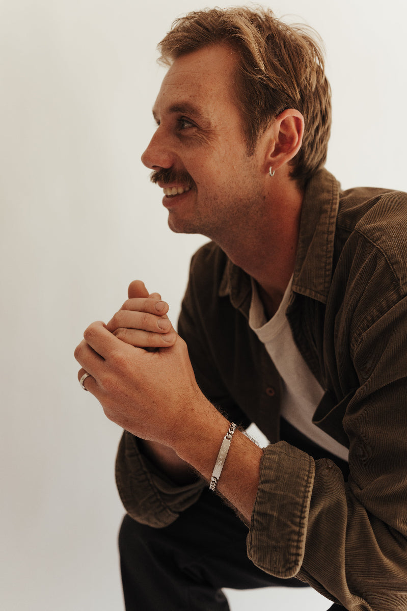 Men's ID Bracelet sits loosely on man's wrist by Bluebird Jewellery