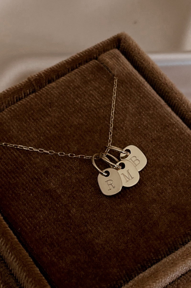The Mini Rectangular Pendants by Bluebird Jewellery features gentle curves and a luxe, modern silhouette. Personalised with your chosen letter, it embodies feminine elegance and can be worn beautifully on any necklace, bracelet, or anklet chain.