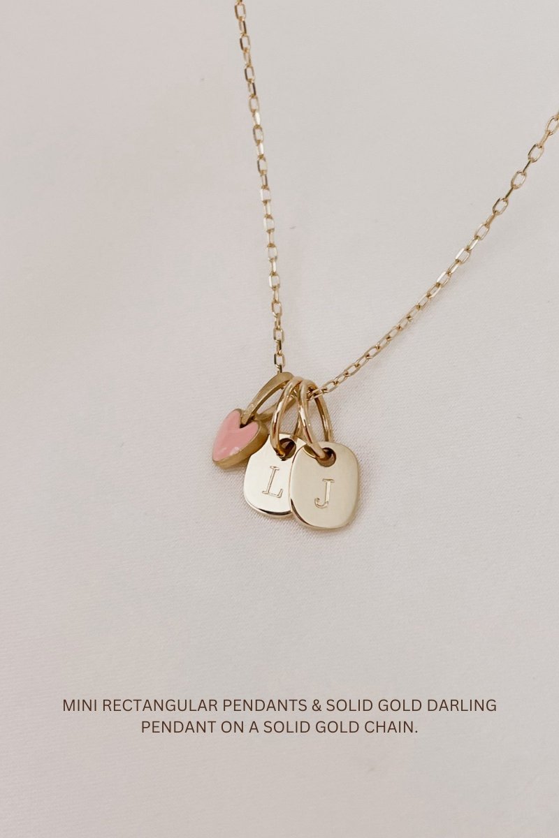 A feminine and contemporary Mini Rectangular Pendant by Bluebird Jewellery, featuring soft curves and a personalised initial engraving, designed for effortless everyday elegance.