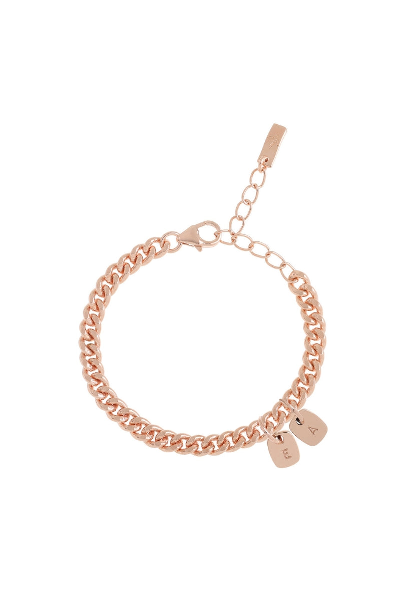 The Cuban Chain Bracelet with Mini Rectangular Pendants by Bluebird Jewellery features gentle curves and a luxe, modern silhouette. Personalised with your chosen letter, it embodies feminine elegance and can be worn beautifully on any necklace, bracelet, or anklet chain.