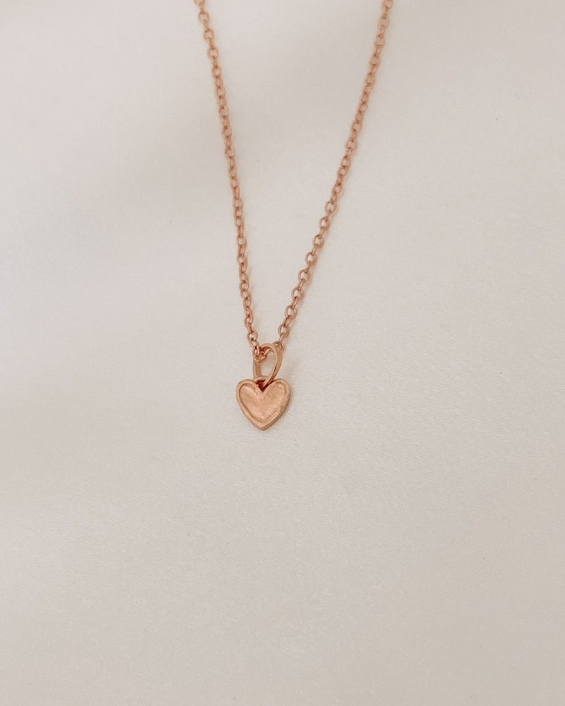 Rose Gold Petite Darling Necklace with an organic shaped petite heart pendant on a fine cable chain necklace.