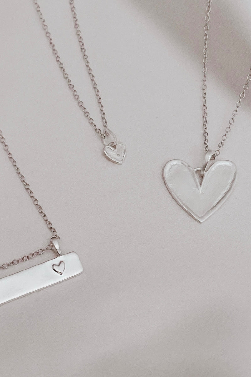 A Darling Bar Necklace, Petite Darling Necklace and Darling Necklace are all shown alongside one another.