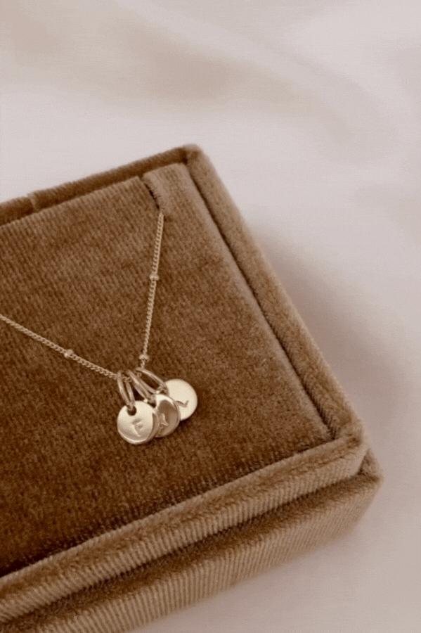 Bluebird Co's ball chain necklace which includes personalised petite necklace in gold with initial pendants.