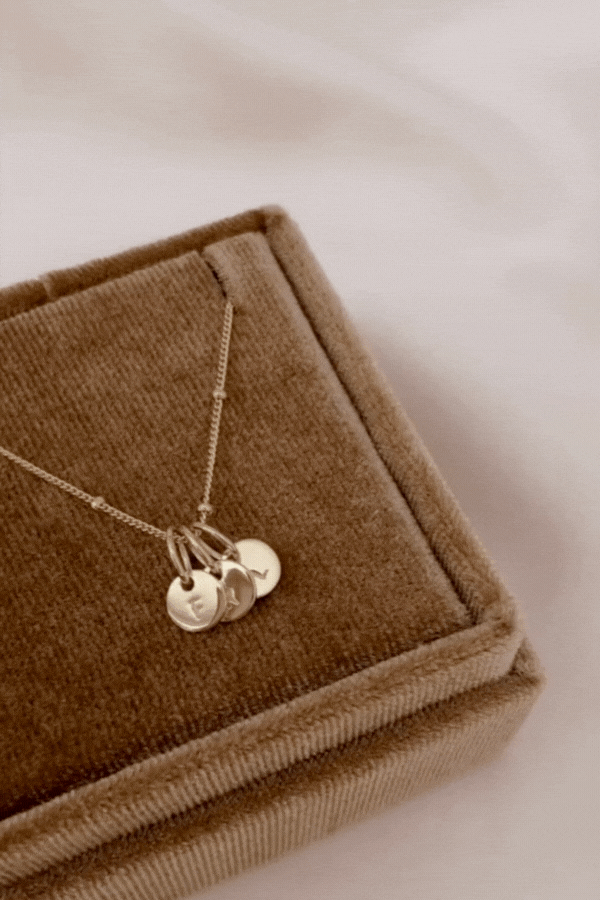 Bluebird Co's ball chain necklace which includes personalised petite necklace in gold with initial pendants.