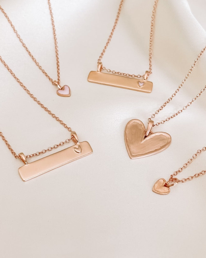 The Pink Petite Darling Necklace is shown alongside other Bluebird Necklaces from the Darling Collection.