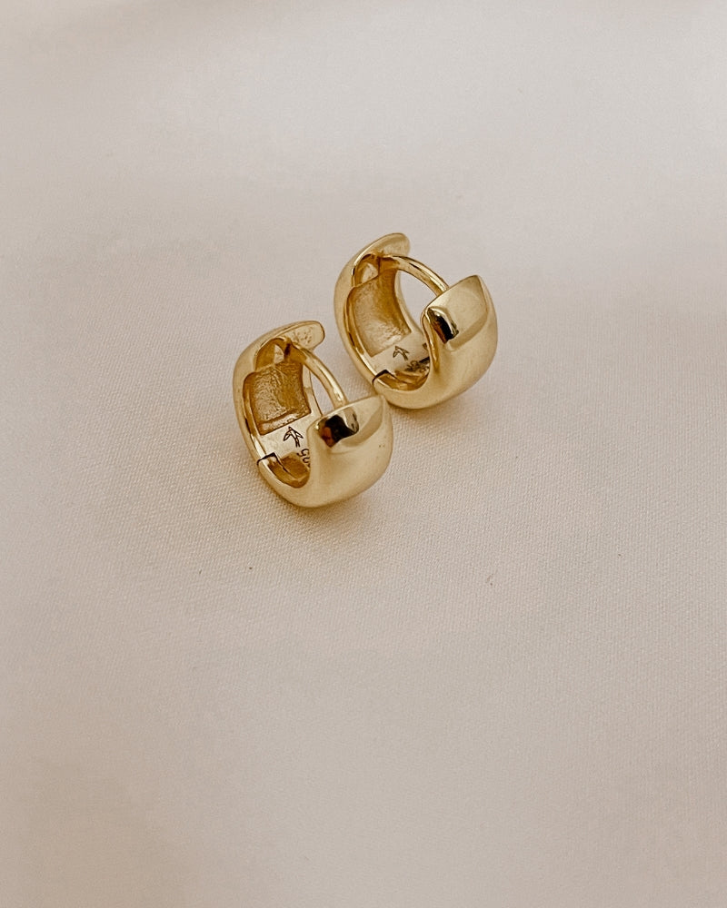 Petite Huggie earrings - gold plated with Bluebird Jewellery logo engraved inside of the earring.