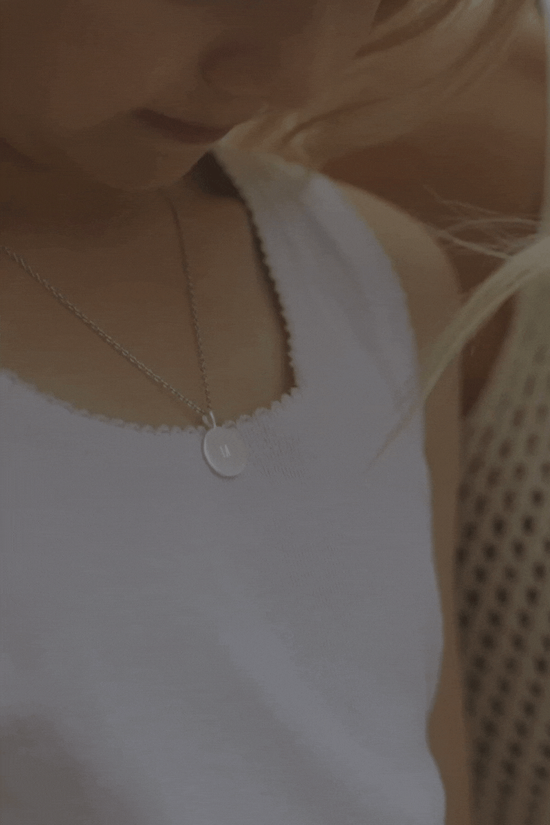 Little Girl wearing the petite signature necklace
