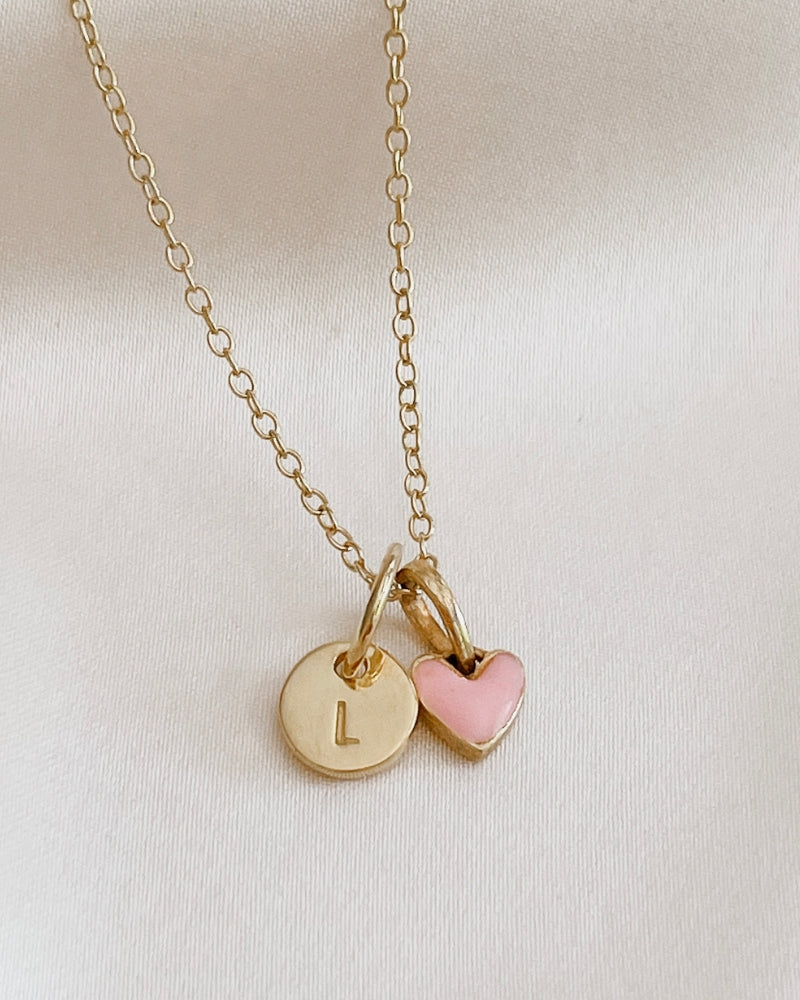 A beautiful close up look at the Pink Petite Darling Necklace with a petite Initial Pendant.