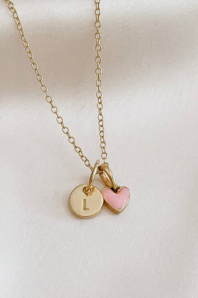 A beautiful close up look at the Pink Petite Darling Necklace with a petite Initial Pendant.