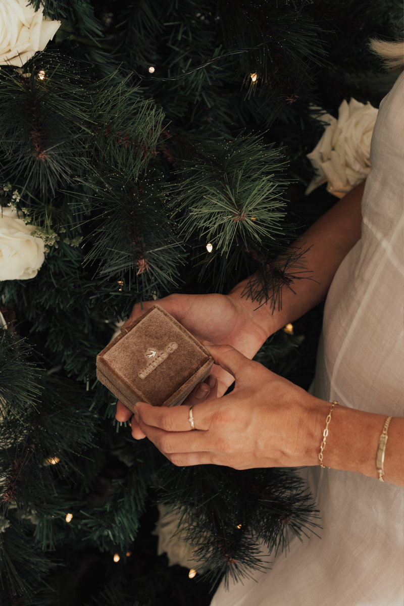 A woman wearing the Posie and Darling Bracelet styled with the matching Darling Ring for an elegant look.