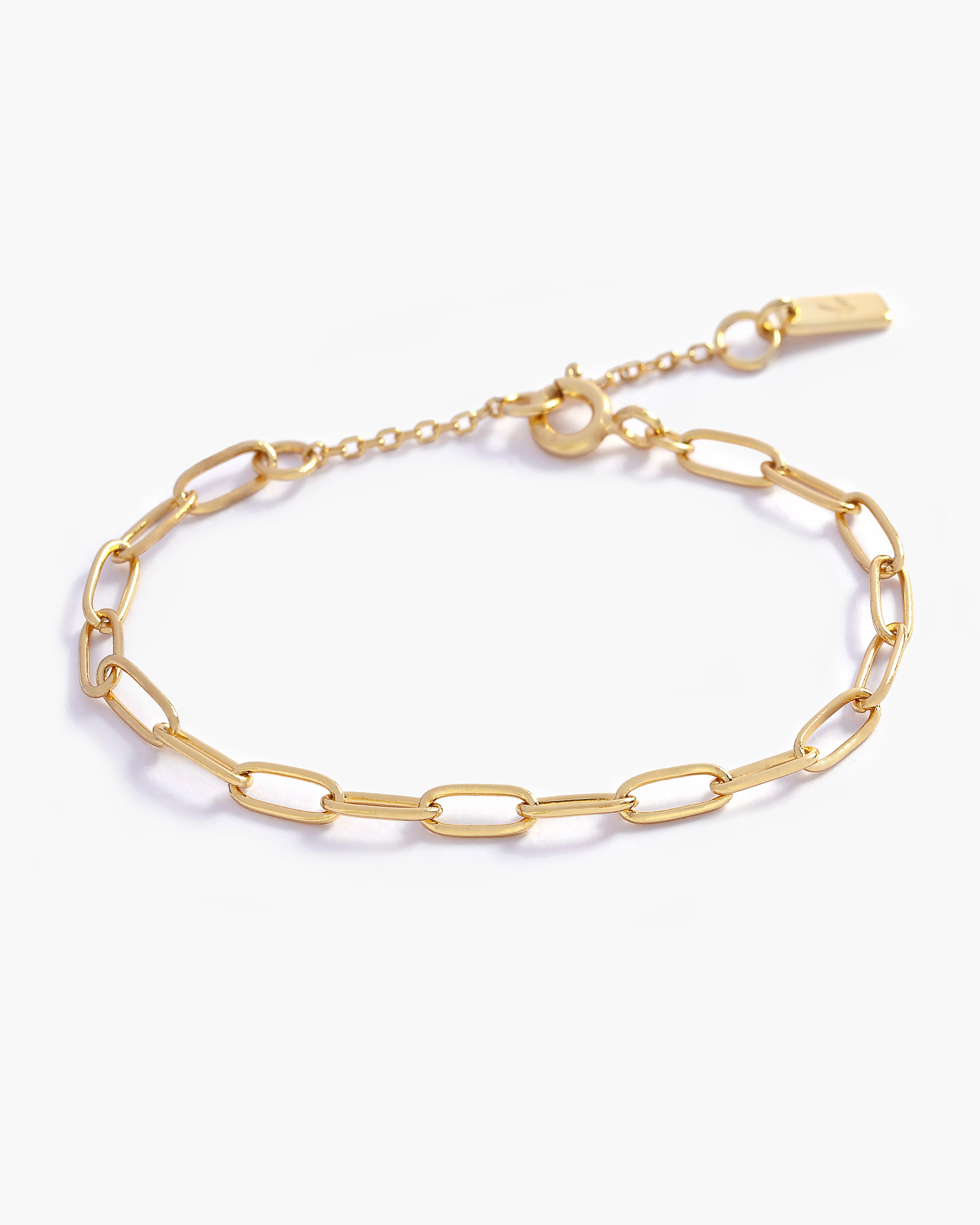 A close-up of an elegant gold chain link bracelet, crafted in fine jewellery style for a modern, feminine touch by Bluebird Jewellery.