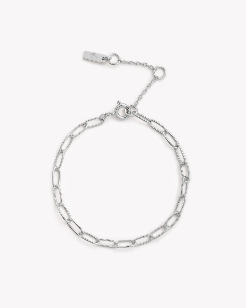 A polished silver bracelet featuring a delicate chain design, displayed on a white background to highlight its craftsmanship by Bluebird Jewellery.