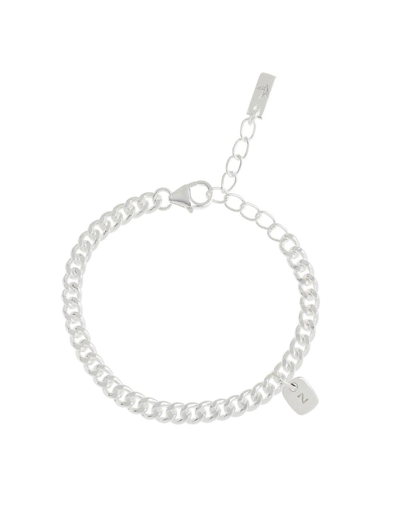 A close-up of a silver Cuban Link Chain with a polished rectangular pendant, designed with a refined minimalist aesthetic