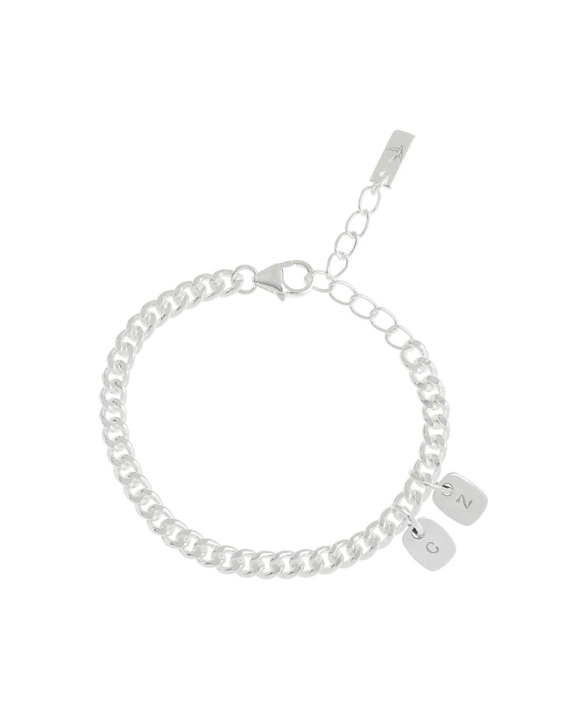 A close-up of a Cuban Link Chain with personalised rectangular pendants, designed with a refined minimalist aesthetic