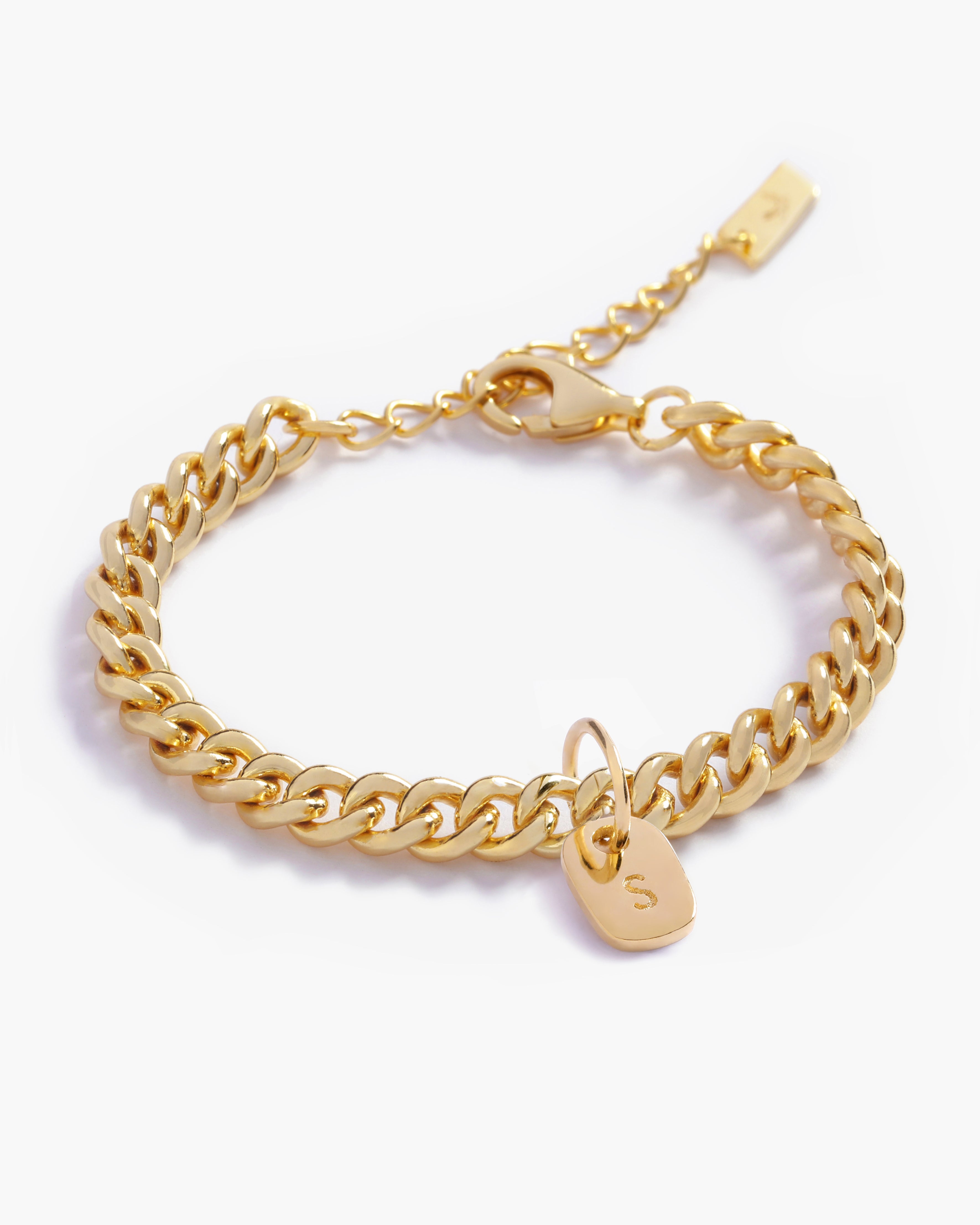 A detailed image of a gold Cuban Link Chain featuring a minimalist rectangular pendant, crafted in elegant fine jewellery style by Bluebird Jewellery.