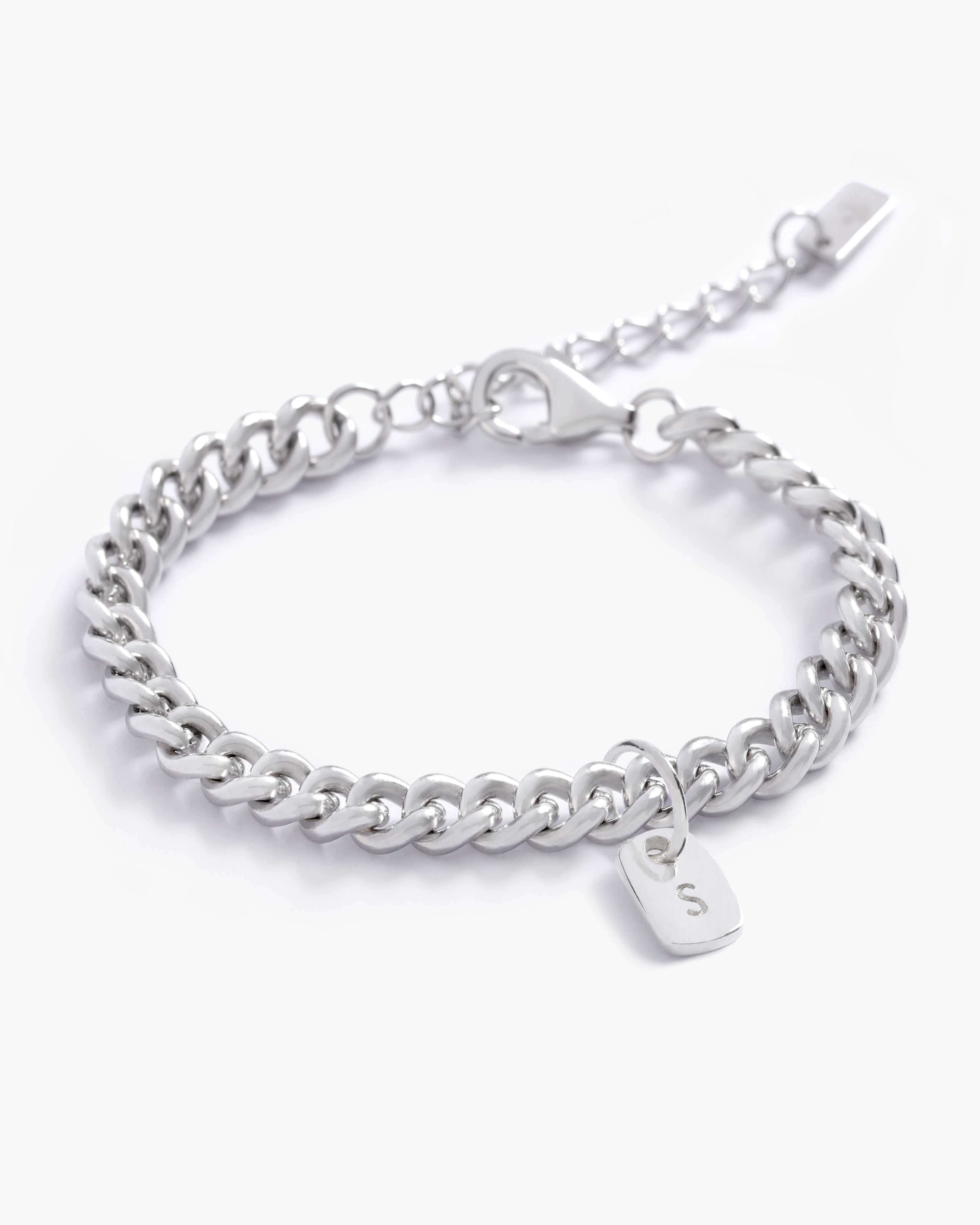 A detailed image of a silver Cuban Link Chain featuring a minimalist rectangular pendant, crafted in elegant fine jewellery style by Bluebird Jewellery.