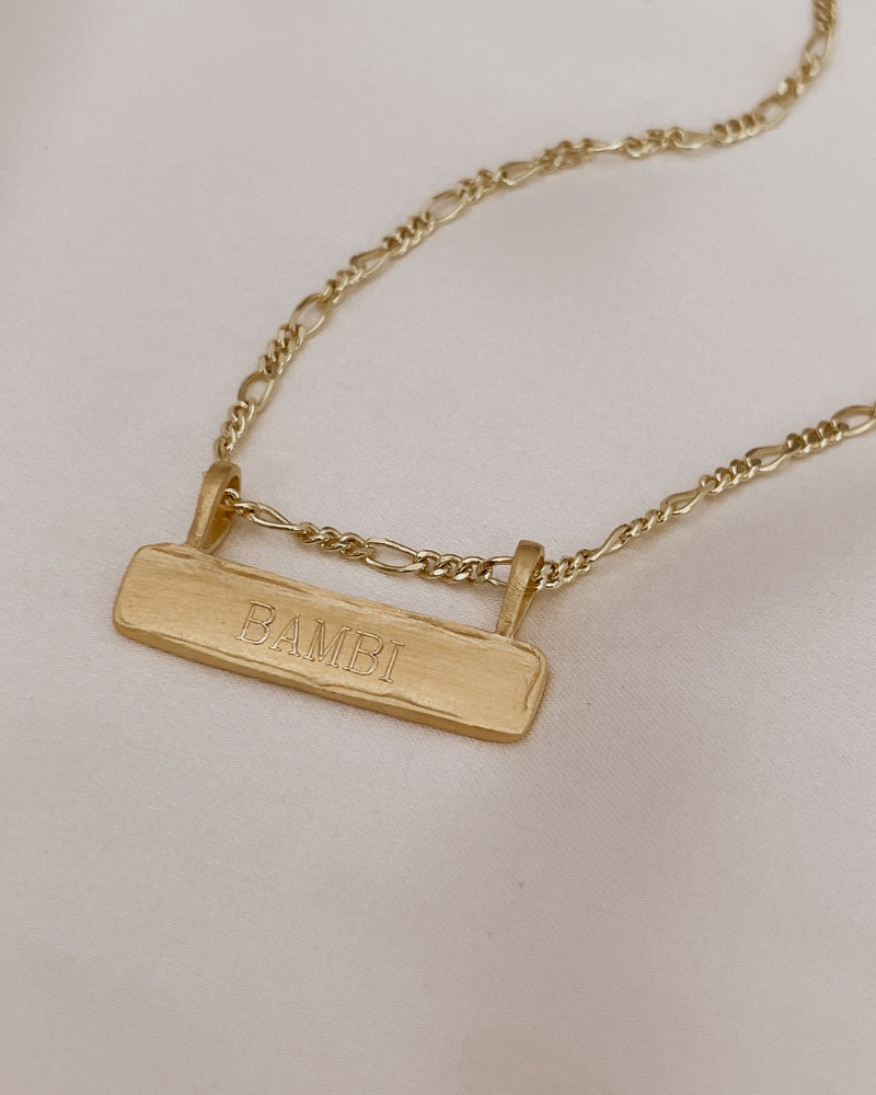 The word Bambi is engraved on the front of a Signature Bar Necklace and looks both timeless and meaningful.