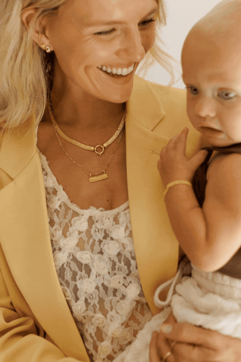 Bluebird Co's signature bar necklace and signature statement necklace and signature bracelet in gold