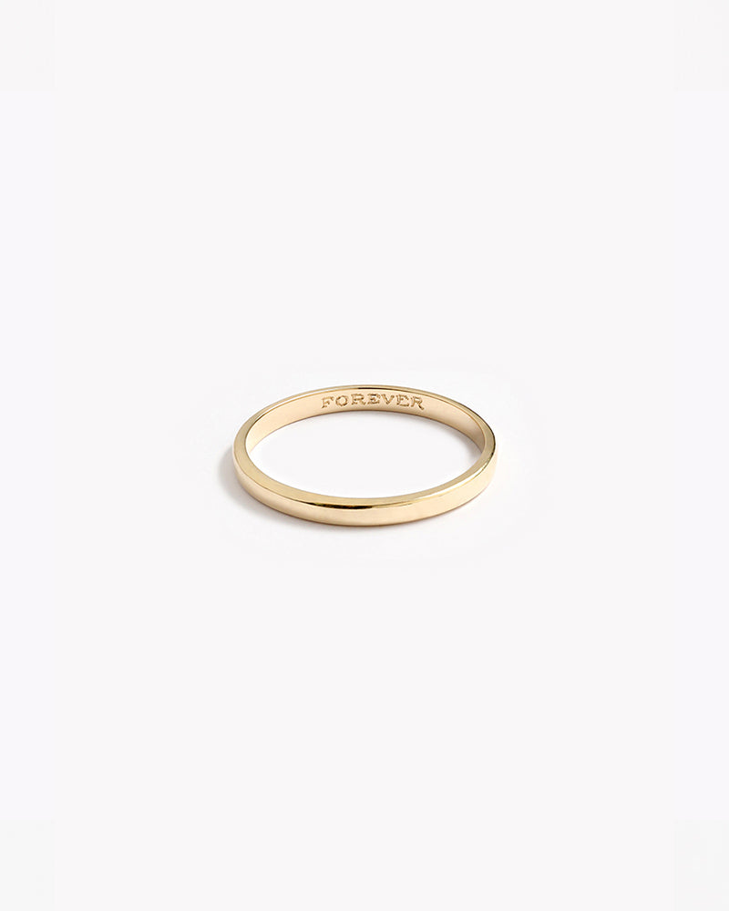 A Signature Pinky Ring with the word 'FOREVER' engraved inside of it.