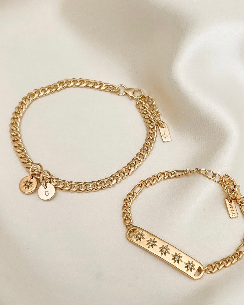 A close-up of a Cuban Link Chain with a single vintage pearl pendant and vintage pearl bracelet, designed as a refined keepsake set by Bluebird Jewellery.