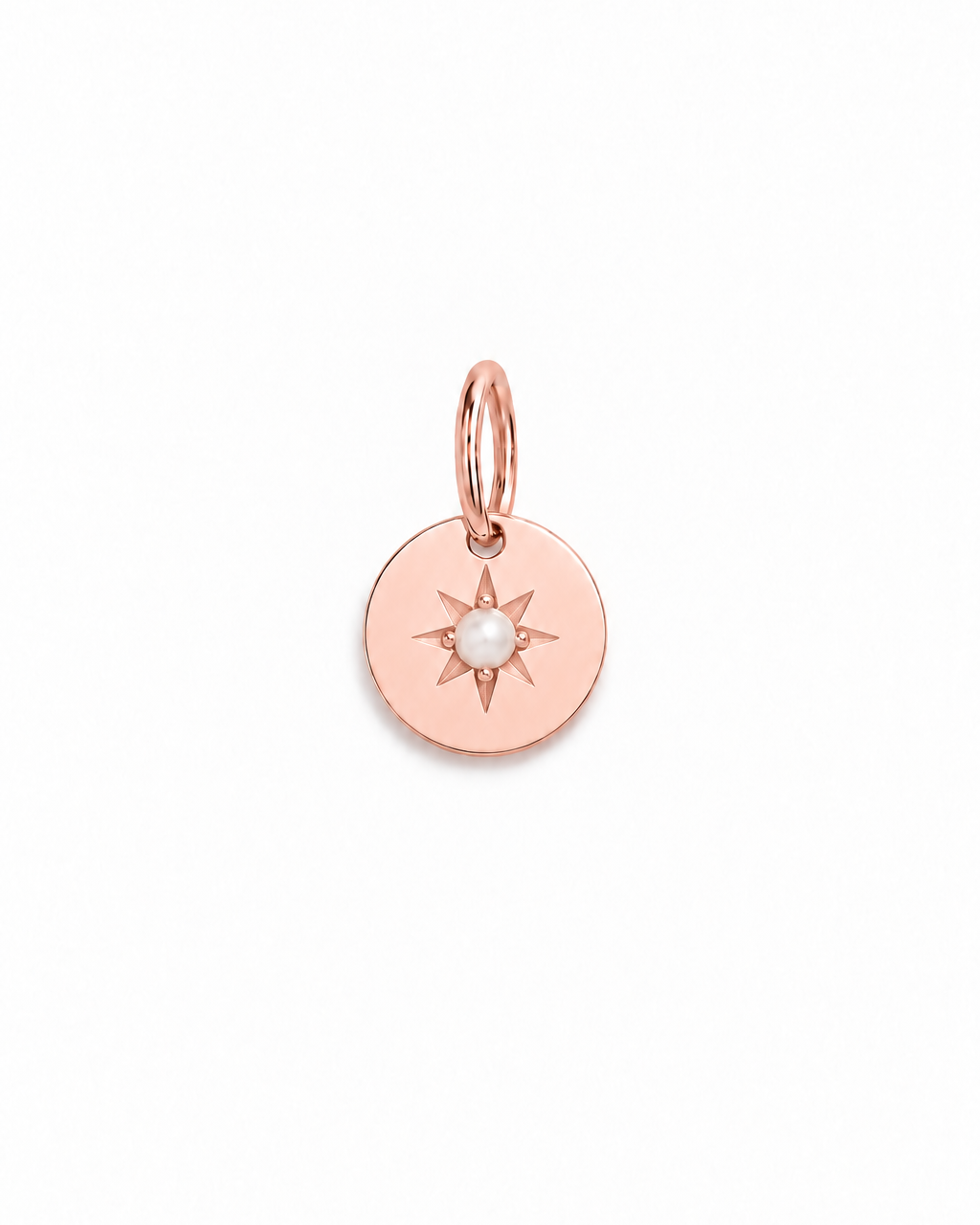A rose gold pendant with a vintage inspired star and seed pearl at its centre.