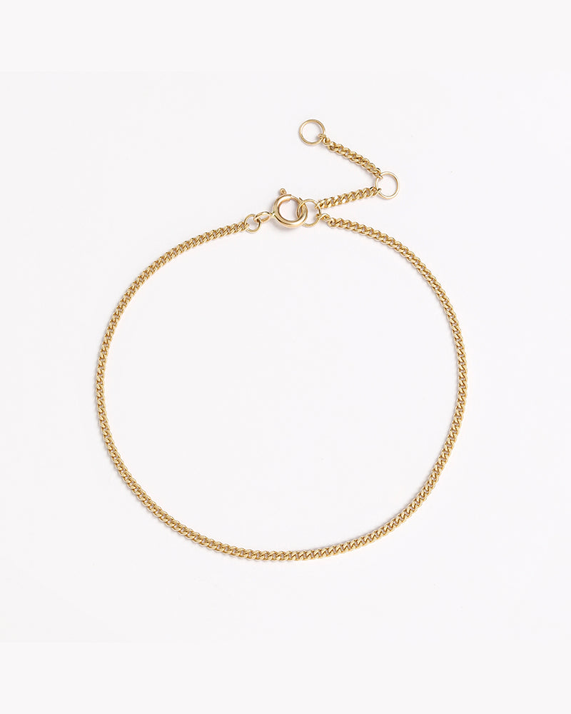 A close-up of the Solid Gold Bracelet by Bluebird Jewellery, crafted in fine gold as a personalised piece for both casual and refined occasions.